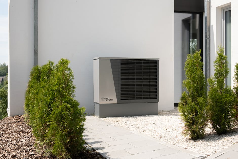 Outdoor heat pump unit with person adjusting control, representing air-to-water heating
